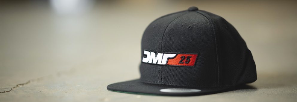 DMR 25 Year Cap from DMR Bikes - Black Snap Back Cap - Casual Cycle Clothing